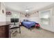 Comfortable bedroom featuring a ceiling fan, desk, and decorations at 3962 Fairington Dr, Marietta, GA 30066