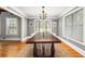 Bright dining room featuring natural light, hardwood floors, and a large wooden dining table at 3962 Fairington Dr, Marietta, GA 30066