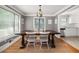 Inviting dining area showcasing hardwood floors, large dining table, and views to the kitchen at 3962 Fairington Dr, Marietta, GA 30066