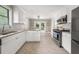 Stylish kitchen boasting white cabinets, stainless steel appliances, and an open layout at 3962 Fairington Dr, Marietta, GA 30066