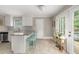 Cozy kitchen showcasing granite countertops, white cabinets, and access to an outdoor deck at 3962 Fairington Dr, Marietta, GA 30066