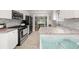 Modern kitchen featuring white cabinets, stainless steel appliances, and granite countertops at 3962 Fairington Dr, Marietta, GA 30066