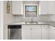 Bright kitchen featuring modern stainless steel appliances, white cabinets, and granite countertops at 3962 Fairington Dr, Marietta, GA 30066