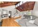 Spacious living room featuring vaulted wood ceilings, hardwood floors, and a cozy seating area at 3962 Fairington Dr, Marietta, GA 30066