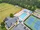 Aerial view of the community pool, tennis courts, and recreation area at 5711 Brynwood Nw Cir, Acworth, GA 30101