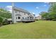 Large backyard featuring a deck with a gazebo, a well-manicured lawn, and mature trees at 5711 Brynwood Nw Cir, Acworth, GA 30101