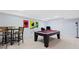 Finished basement with a pool table, seating, and a television for entertainment at 5711 Brynwood Nw Cir, Acworth, GA 30101