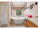 Bathroom featuring a standalone soaking tub and granite countertop vanity at 5711 Brynwood Nw Cir, Acworth, GA 30101