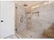 Modern walk-in shower with designer tile and dual shower heads in a well lit bathroom with a glass door at 5711 Brynwood Nw Cir, Acworth, GA 30101