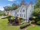 Side angle of a beautiful two-story home with a well-maintained yard, lush landscaping, and a inviting walkway at 5711 Brynwood Nw Cir, Acworth, GA 30101