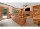 Cozy living room featuring built-in bookshelves, a fireplace, and a comfortable seating area perfect for relaxation at 5711 Brynwood Nw Cir, Acworth, GA 30101