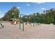 Community playground with swings, slides, and benches surrounded by lush greenery at 5711 Brynwood Nw Cir, Acworth, GA 30101
