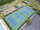Aerial view of the tennis courts with playground and basketball court nearby at 5711 Brynwood Nw Cir, Acworth, GA 30101
