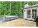 Relaxing back deck surrounded by lush greenery perfect for outdoor dining and entertaining at 80 Maryeanna Dr, Sandy Springs, GA 30342
