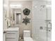 Clean and modern bathroom with tiled shower, marble top vanity, and updated fixtures at 80 Maryeanna Dr, Sandy Springs, GA 30342