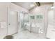 Bright bathroom with soaking tub, marble floors, and premium finishes at 80 Maryeanna Dr, Sandy Springs, GA 30342