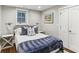 Cozy bedroom with hardwood floors, closet and lots of natural light from the window at 80 Maryeanna Dr, Sandy Springs, GA 30342
