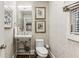 Stylish powder room features modern fixtures, patterned wallpaper and eye-catching decor at 80 Maryeanna Dr, Sandy Springs, GA 30342