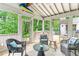 Bright sunroom with stone floors and plenty of natural light, offering a relaxing retreat at 80 Maryeanna Dr, Sandy Springs, GA 30342