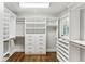 Custom walk-in closet offers ample storage with built-in shelving and drawers at 80 Maryeanna Dr, Sandy Springs, GA 30342