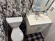 Cozy bathroom with a decorative mirror and white vanity with a black and white theme at 20 Marietta Nw St # 13C, Atlanta, GA 30303