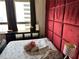 Bedroom features a padded headboard, plenty of natural light, and classic furnishings at 20 Marietta Nw St # 13C, Atlanta, GA 30303