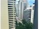 Urban view of buildings with trees lining the street at 20 Marietta Nw St # 13C, Atlanta, GA 30303