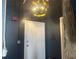Hallway view with a unique decorative light fixture at 20 Marietta Nw St # 13C, Atlanta, GA 30303