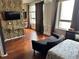 Open-concept living space with hardwood floors, abundant natural light, and modern decor at 20 Marietta Nw St # 13C, Atlanta, GA 30303