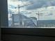 View of Atlanta Falcons Stadium framed by window looking out to sky at 20 Marietta Nw St # 13C, Atlanta, GA 30303
