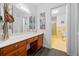 Bright bathroom with vanity and adjacent separate room with toilet and tiled shower at 200 Mcguirts Bridge Rd, Covington, GA 30014