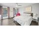 Cozy bedroom with hardwood floors, natural light, and a comfortable bed at 200 Mcguirts Bridge Rd, Covington, GA 30014