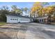 A nice home with a large driveway and an attached three-car garage at 200 Mcguirts Bridge Rd, Covington, GA 30014