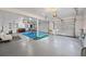 Large garage with dining area, seating, and extra room for vehicles and storage at 200 Mcguirts Bridge Rd, Covington, GA 30014