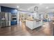 Bright kitchen featuring stainless steel appliances, a center island, and hardwood floors at 200 Mcguirts Bridge Rd, Covington, GA 30014