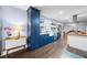 Stylish kitchen with blue cabinets, stainless steel appliances, and hardwood flooring at 200 Mcguirts Bridge Rd, Covington, GA 30014