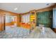 Inviting living space features a window seat, bookshelves, and a dining area with comfortable seating at 200 Mcguirts Bridge Rd, Covington, GA 30014