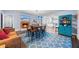 Inviting living room with a brick fireplace, comfortable seating, and seamless transition to a modern kitchen at 200 Mcguirts Bridge Rd, Covington, GA 30014
