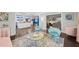 Open-concept living room with blue and pink accents, hardwood floors, and modern decor at 200 Mcguirts Bridge Rd, Covington, GA 30014