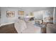 Spacious living room with hardwood floors, a fireplace, and ample seating at 200 Mcguirts Bridge Rd, Covington, GA 30014