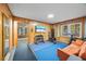 Home gym with wood paneled walls, workout equipment, and natural light at 200 Mcguirts Bridge Rd, Covington, GA 30014