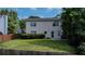 View of the home's backyard featuring a well maintained lawn, wood fence and a variety of trees at 2163 Berryhill Se Cir, Smyrna, GA 30082