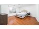 Bright bedroom with hardwood floors and a comfortable queen-sized bed at 2163 Berryhill Se Cir, Smyrna, GA 30082