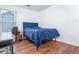 Simple bedroom with hardwood floors, a bed, a desk, and a window at 2163 Berryhill Se Cir, Smyrna, GA 30082