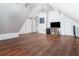 Open bonus room with wood floors, lots of space, a ceiling fan, and neutral walls at 2163 Berryhill Se Cir, Smyrna, GA 30082
