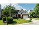 Charming one story brick home with a well manicured lawn, two-car garage, and inviting blue front door at 2163 Berryhill Se Cir, Smyrna, GA 30082