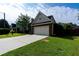 Well-kept home showcasing a two-car garage, verdant lawn, and neat landscaping at 2163 Berryhill Se Cir, Smyrna, GA 30082