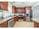 Modern kitchen boasts stainless steel appliances and stylish granite countertops at 2163 Berryhill Se Cir, Smyrna, GA 30082