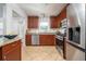Well-equipped kitchen featuring stainless steel appliances and a breakfast bar at 2163 Berryhill Se Cir, Smyrna, GA 30082
