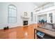 Bright living room featuring high ceilings, large windows, fireplace, and hardwood flooring at 2163 Berryhill Se Cir, Smyrna, GA 30082